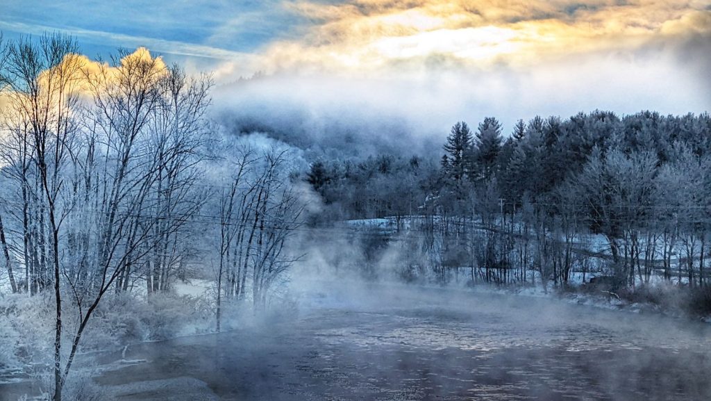 the Deerfield River on a snowy winter morning with vapor rising off the water